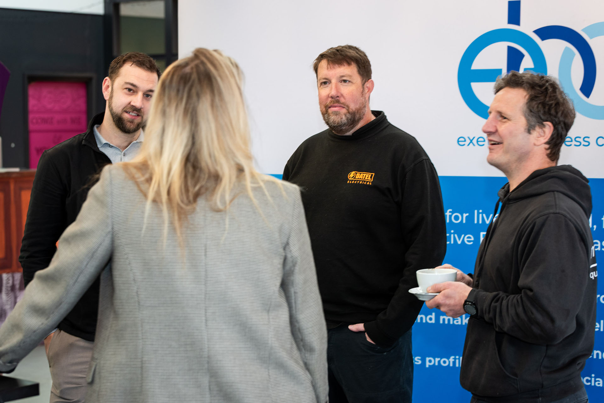 Members chatting over a cuppa before a Friday meeting